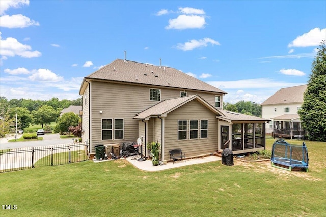 150 Saint Mellion St, Raleigh, NC 27603 - rear view of house featuring a sunroom, a trampoline, a patio, and a shingled roof
