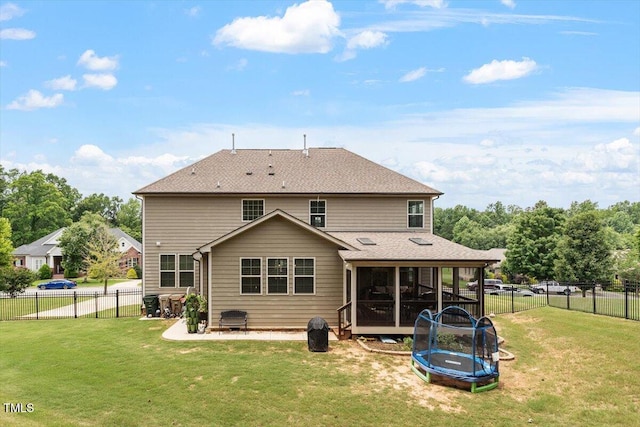 150 Saint Mellion St, Raleigh, NC 27603 - rear view of house featuring a trampoline, a sunroom, a fenced backyard, and a shingled roof