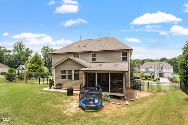 150 Saint Mellion St, Raleigh, NC 27603 - rear view of house with a trampoline, a sunroom, a fenced backyard, roof with shingles, and a patio area