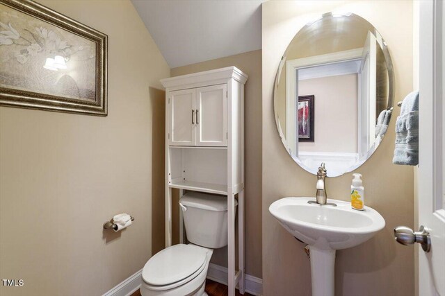 150 Saint Mellion St, Raleigh, NC 27603 - half bath featuring toilet and lofted ceiling