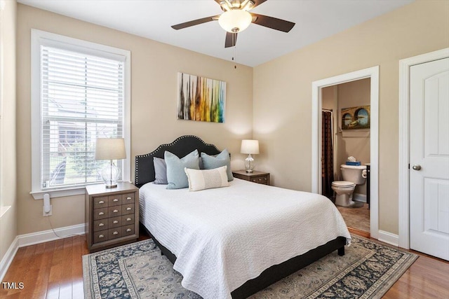 150 Saint Mellion St, Raleigh, NC 27603 - bedroom featuring wood finished floors, connected bathroom, and ceiling fan