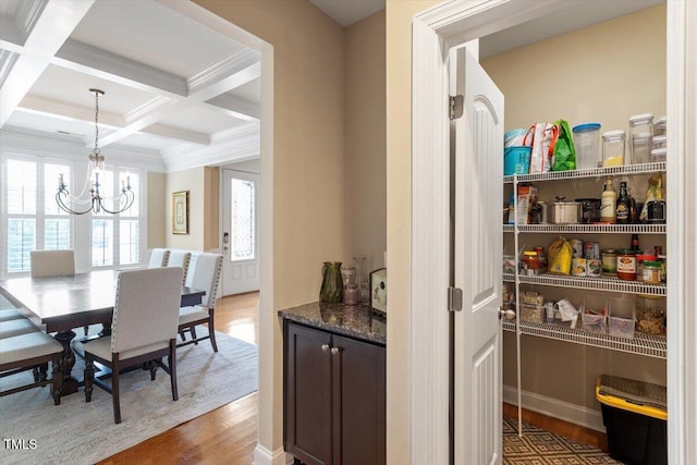 150 Saint Mellion St, Raleigh, NC 27603 - dining space with wood finished floors, beam ceiling, a chandelier, coffered ceiling, and ornamental molding