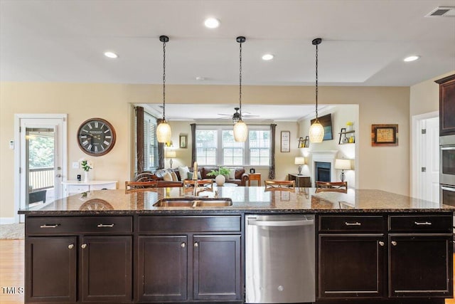 150 Saint Mellion St, Raleigh, NC 27603 - kitchen featuring dishwasher, open floor plan, recessed lighting, dark stone countertops, and ceiling fan
