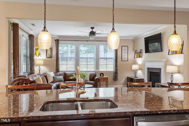 150 Saint Mellion St, Raleigh, NC 27603 - kitchen with open floor plan, dishwasher, crown molding, a ceiling fan, and a fireplace
