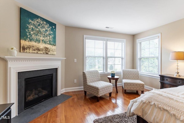 150 Saint Mellion St, Raleigh, NC 27603 - bedroom featuring wood-type flooring and a fireplace with flush hearth