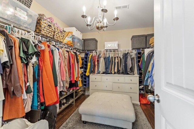 150 Saint Mellion St, Raleigh, NC 27603 - walk in closet featuring wood finished floors and a chandelier
