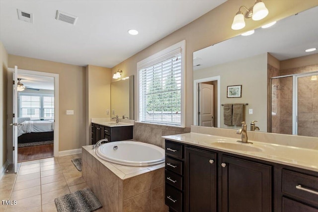 150 Saint Mellion St, Raleigh, NC 27603 - ensuite bathroom with a shower stall, a bath, two vanities, tile patterned flooring, and ceiling fan