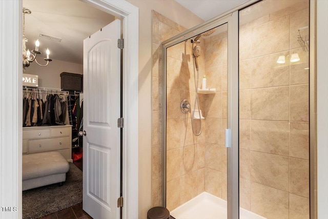150 Saint Mellion St, Raleigh, NC 27603 - bathroom featuring a stall shower, a walk in closet, and wood finished floors