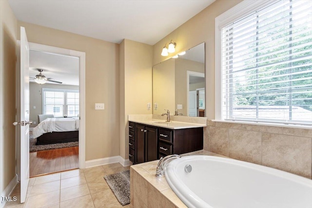 150 Saint Mellion St, Raleigh, NC 27603 - bathroom with vanity, a bath, tile patterned flooring, connected bathroom, and ceiling fan