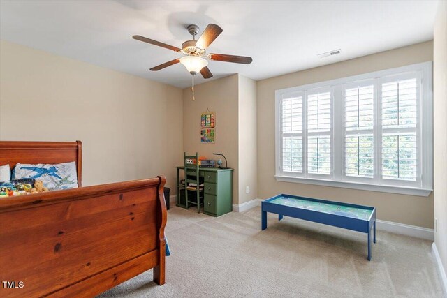 150 Saint Mellion St, Raleigh, NC 27603 - bedroom with multiple windows, light carpet, and ceiling fan