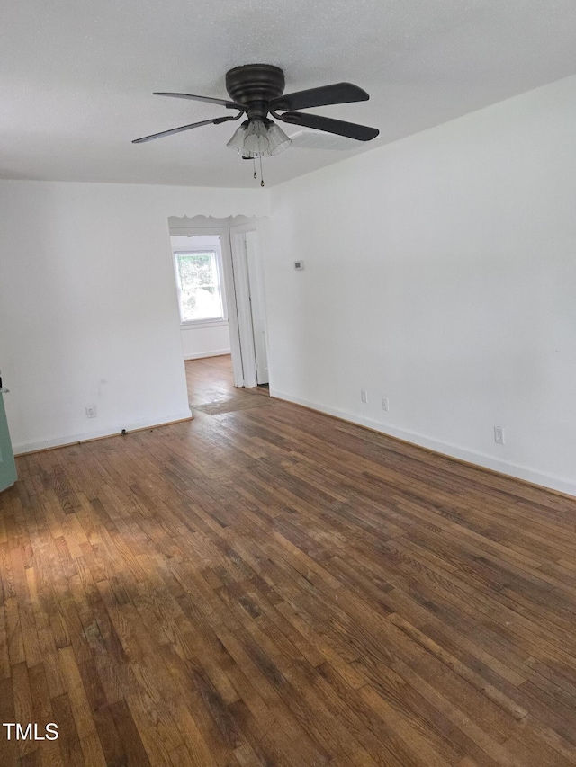 704 N King Charles Rd, Raleigh, NC 27610 - empty room featuring dark wood-type flooring and a ceiling fan