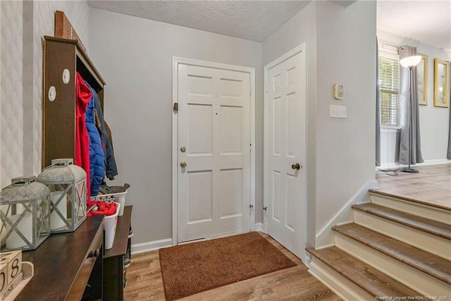 140 Bledsoe St, Hope Mills, NC 28348 - foyer entrance featuring wood finished floors and baseboards