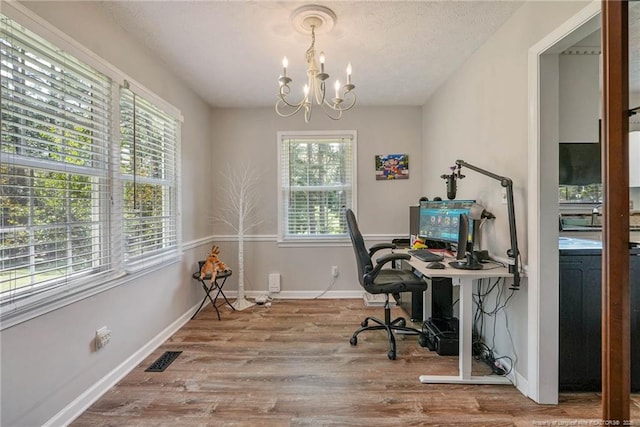 140 Bledsoe St, Hope Mills, NC 28348 - office area featuring a chandelier, wood finished floors, and a textured ceiling