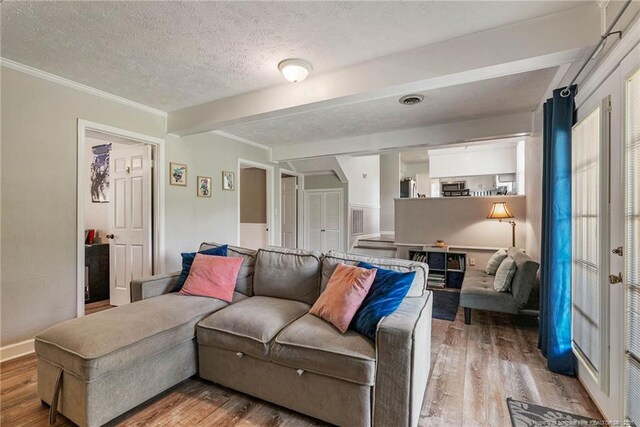 140 Bledsoe St, Hope Mills, NC 28348 - living area featuring wood finished floors, a textured ceiling, crown molding, and beamed ceiling