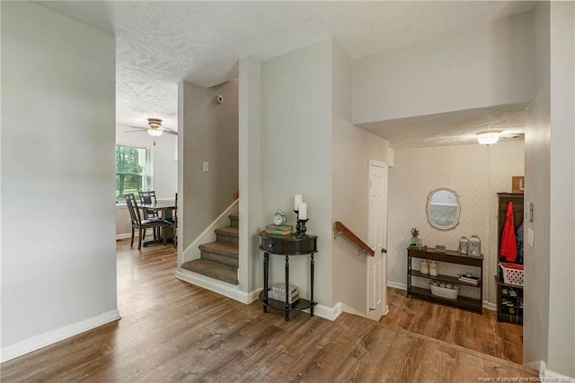 140 Bledsoe St, Hope Mills, NC 28348 - stairway featuring a textured ceiling, wood finished floors, and a ceiling fan