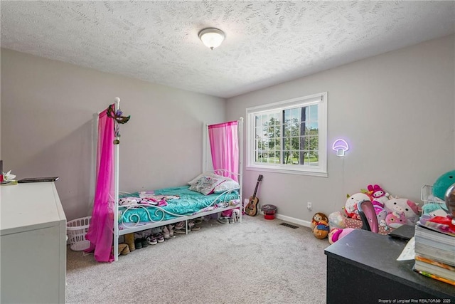 140 Bledsoe St, Hope Mills, NC 28348 - carpeted bedroom with a textured ceiling and baseboards