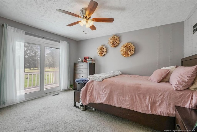 140 Bledsoe St, Hope Mills, NC 28348 - carpeted bedroom with a textured ceiling, a ceiling fan, and access to outside