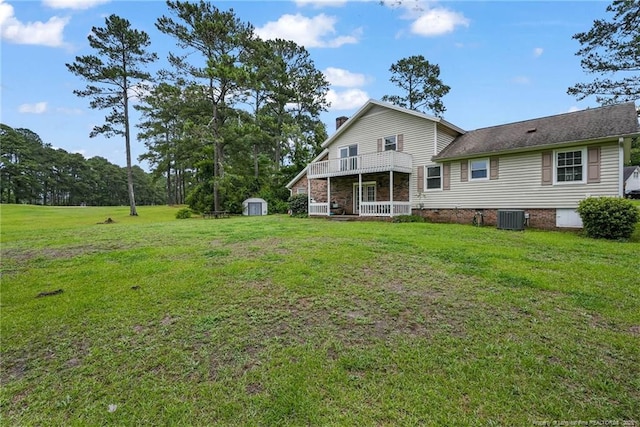 140 Bledsoe St, Hope Mills, NC 28348 - rear view of property featuring a storage shed, a yard, a chimney, a balcony, and crawl space