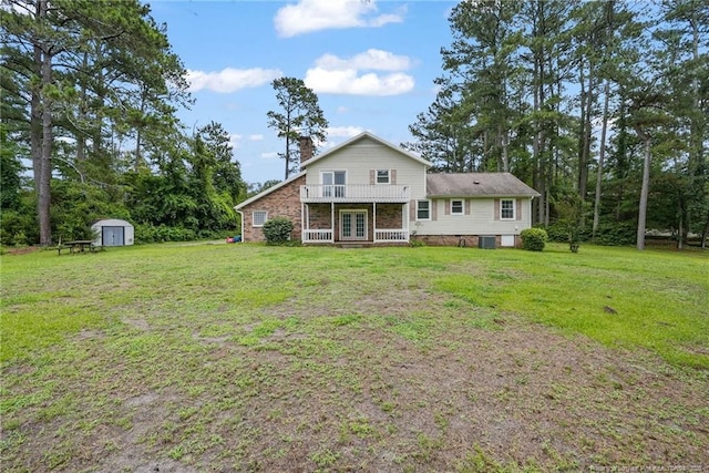 140 Bledsoe St, Hope Mills, NC 28348 - back of property featuring a storage shed, french doors, a lawn, a chimney, and a balcony