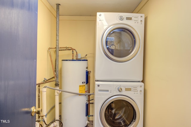 2009 Carolina Ave, Durham, NC 27705 - washroom with electric water heater and estacked washer and dryer