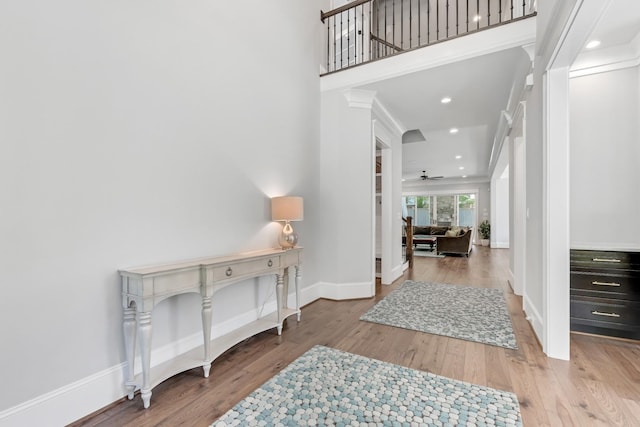 6900 Staghorn Ln, Raleigh, NC 27615 - foyer with wood finished floors, a ceiling fan, ornate columns, and recessed lighting