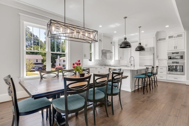 6900 Staghorn Ln, Raleigh, NC 27615 - dining room with dark wood-type flooring, a chandelier, and recessed lighting