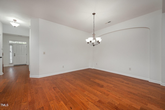 1016 Kingston Grove Dr, Cary, NC 27519 - unfurnished room with wood finished floors and a chandelier