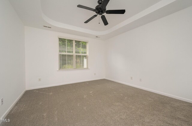 1016 Kingston Grove Dr, Cary, NC 27519 - carpeted empty room with a raised ceiling and ceiling fan