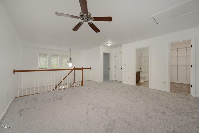 1016 Kingston Grove Dr, Cary, NC 27519 - unfurnished room with carpet floors, a ceiling fan, and attic access