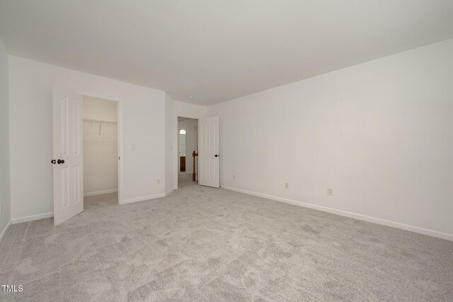 1016 Kingston Grove Dr, Cary, NC 27519 - unfurnished bedroom with light carpet and a spacious closet
