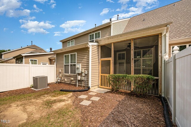 1016 Kingston Grove Dr, Cary, NC 27519 - back of house with a sunroom and a fenced backyard