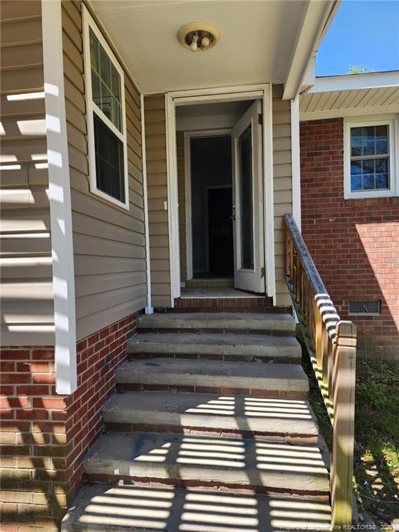 805 Perley St, Fayetteville, NC 28305 - doorway to property featuring crawl space and brick siding