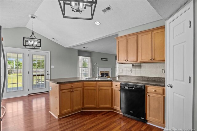 2720 Daniel Boone Ln, Hope Mills, NC 28348 - kitchen featuring dishwasher, a chandelier, dark countertops, lofted ceiling, and a peninsula