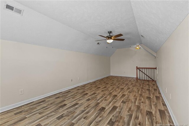 2720 Daniel Boone Ln, Hope Mills, NC 28348 - additional living space featuring wood finished floors, vaulted ceiling, ceiling fan, and a textured ceiling
