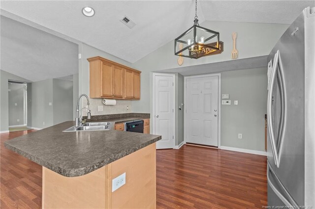 2720 Daniel Boone Ln, Hope Mills, NC 28348 - kitchen featuring freestanding refrigerator, dark countertops, lofted ceiling, a chandelier, and a peninsula