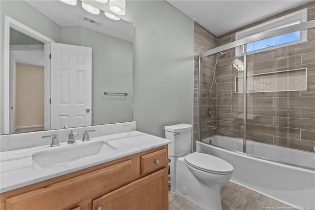2720 Daniel Boone Ln, Hope Mills, NC 28348 - full bath with vanity, wood finished floors, and bath / shower combo with glass door