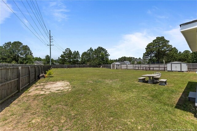 2720 Daniel Boone Ln, Hope Mills, NC 28348 - fenced backyard featuring a storage shed