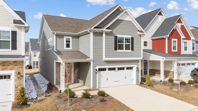 2346 Mckenzie Ridge Ln, Apex, NC 27502 - view of front of home featuring a garage, roof with shingles, concrete driveway, and stone siding