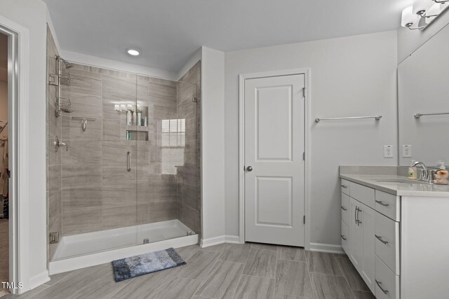 2346 Mckenzie Ridge Ln, Apex, NC 27502 - bathroom with vanity, a stall shower, and recessed lighting
