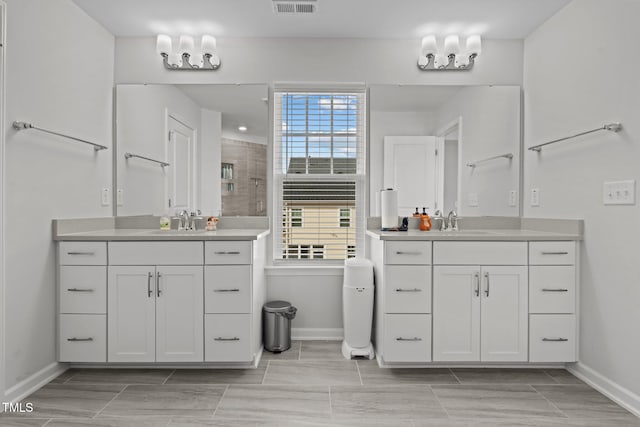 2346 Mckenzie Ridge Ln, Apex, NC 27502 - bathroom featuring two vanities and tiled shower