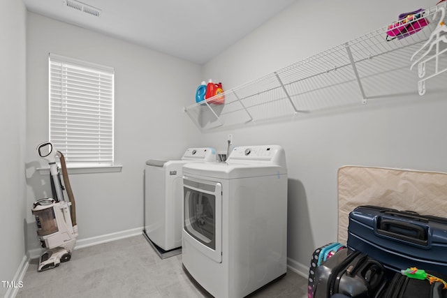 2346 Mckenzie Ridge Ln, Apex, NC 27502 - laundry area with washing machine and dryer and baseboards