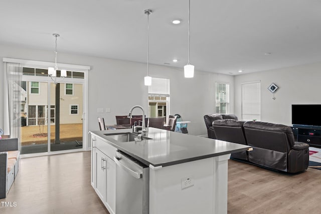 2346 Mckenzie Ridge Ln, Apex, NC 27502 - kitchen with dishwasher, light wood-style floors, white cabinets, recessed lighting, and decorative light fixtures