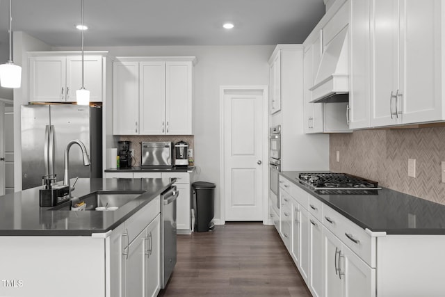 2346 Mckenzie Ridge Ln, Apex, NC 27502 - kitchen featuring stainless steel appliances, dark countertops, dark wood-style flooring, backsplash, and recessed lighting