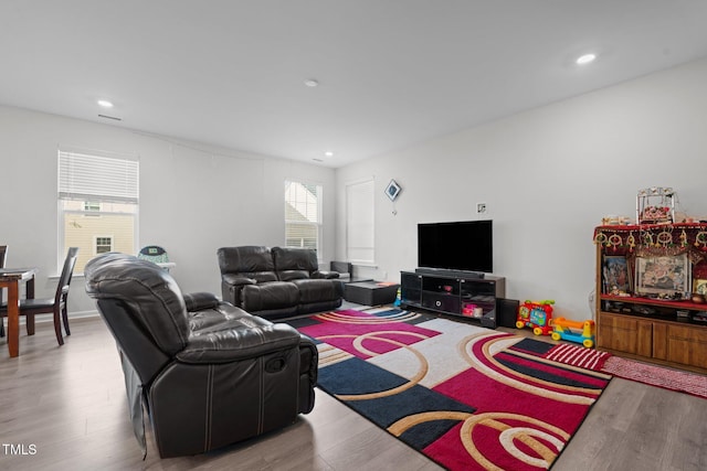 2346 Mckenzie Ridge Ln, Apex, NC 27502 - living area with plenty of natural light, wood finished floors, and recessed lighting