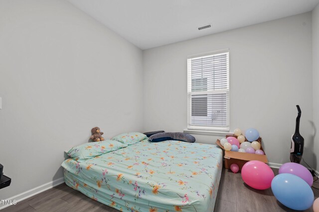 2346 Mckenzie Ridge Ln, Apex, NC 27502 - bedroom featuring wood finished floors and baseboards