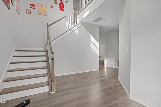 2346 Mckenzie Ridge Ln, Apex, NC 27502 - stairway featuring wood finished floors and baseboards