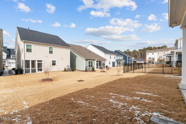 2346 Mckenzie Ridge Ln, Apex, NC 27502 - back of property with a residential view and a sunroom