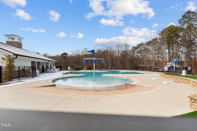 2346 Mckenzie Ridge Ln, Apex, NC 27502 - community pool with a patio area and view of scattered trees