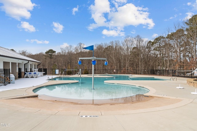2346 Mckenzie Ridge Ln, Apex, NC 27502 - community pool featuring a patio area and view of scattered trees