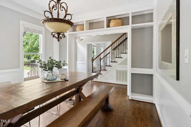 5809 N Hawthorne Way, Raleigh, NC 27603 - dining room featuring dark wood-style floors, crown molding, and stairway